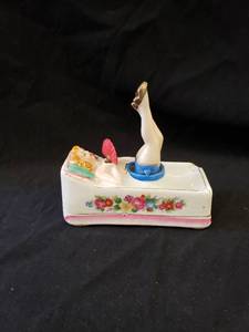 lot 2006 image: antique floating lady ashtray