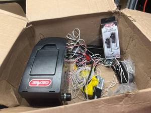 lot 163 image: genie garage door opener with extra parts