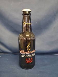 lot 14337 image: 14 in Tall Budweiser Proud Supporter of the 2000s Olympic Team Collectors Bottle