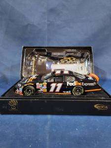 lot 14021 image: DENNY HAMLIN 2006 ROOKIE OF THE YEAR FEDEX EXPRESS 124 ACTION DIECAST CAR