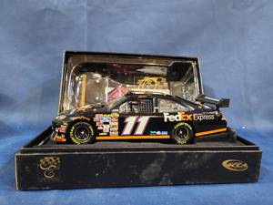 lot 14022 image: DENNY HAMLIN 2006 ROOKIE OF THE YEAR FEDEX EXPRESS 124 ACTION DIECAST CAR