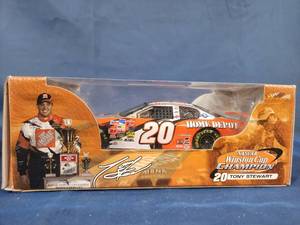 lot 14537 image: 2002 Action NASCAR Winston Cup Champion Tony Stewart #20 Die-Cast Home Depot