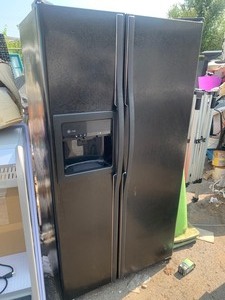 lot 33 image: General Electric Dual Sided Refrigerator 26.5x36x69