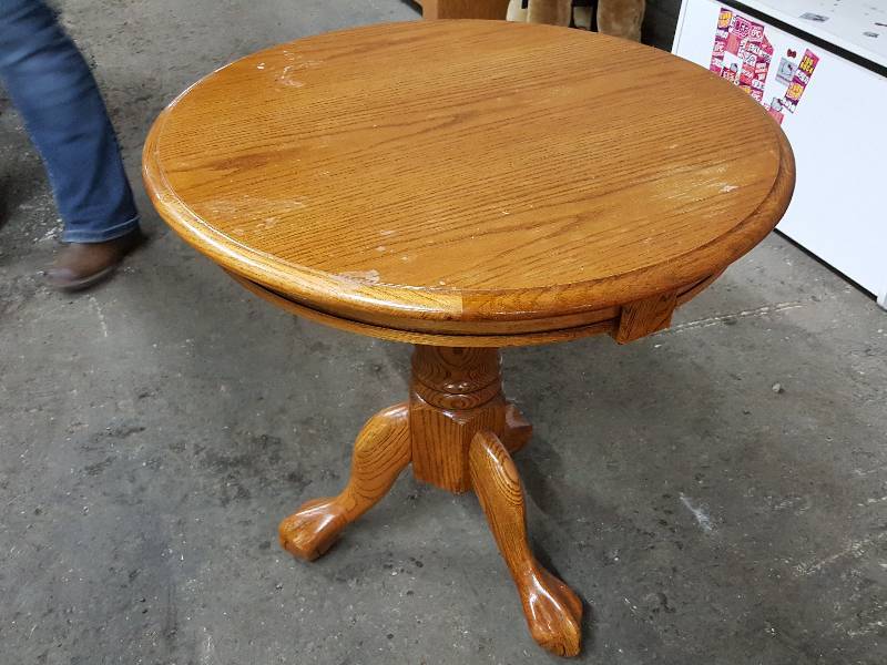 lot 2007 image: Nice quality 24 diameter and 25 off the floor all solid wood 3 legged table.