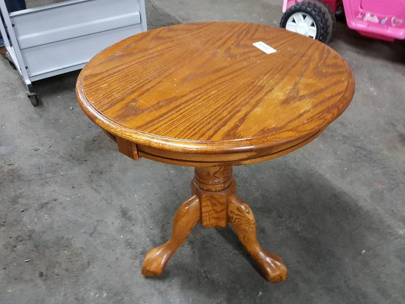 lot 2008 image: Nice quality 24 diameter and 25 off the floor all solid wood 3 legged table.