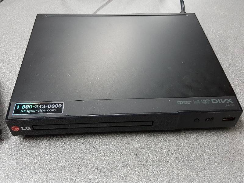 lot 2016 image: LG DVD player with cord, remote and powers up fine