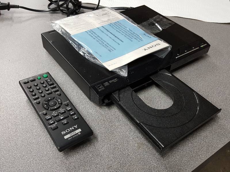 lot 2017 image: Sony DVD player with cord, remote and powers up fine