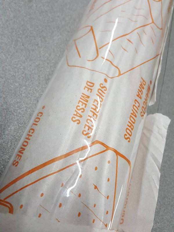 lot 2018 image: Roll of protective 48 wide plastic sold for windows, tables or whatever you need liquid or weather protection on.