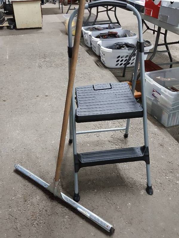 lot 2035 image: Handy and looks like its never been used is the Cosco 2 step ladder and the big bonus