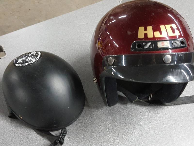 lot 2046 image: His and hers motorcycling helmets.  HJC brand on the size small and Voss Skull Cap is a medium