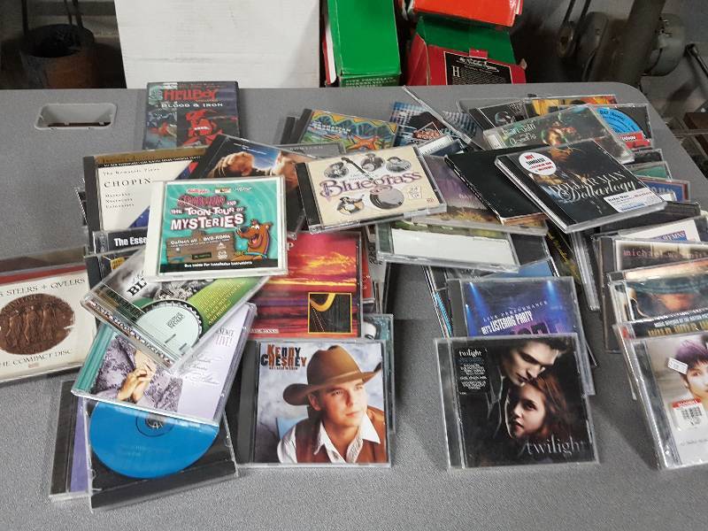 lot 2086 image: Just imagine getting a $$$$ dollar a piece in your flea market boot. Youll make some bucks with this big tote of CDs.