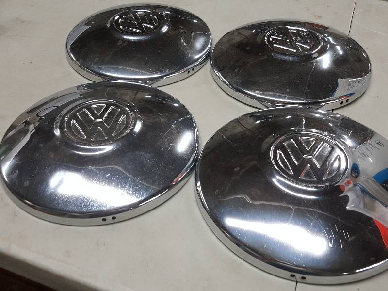 lot 2087 image: Set of 4 original Volkswagen wheel hub caps.  Not too bad of condition for as old as these are.