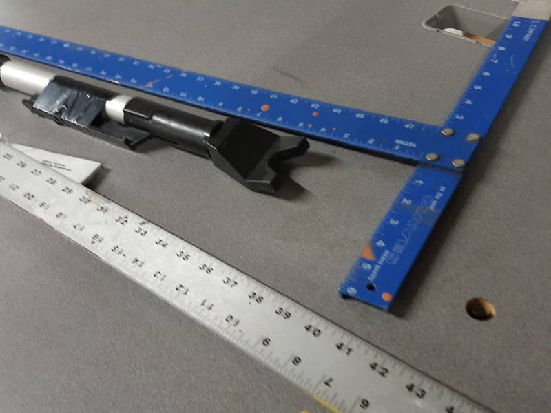 lot 2098 image: Nice 3 piece package here with the pair of aluminum Tri Squares and the adjustable length Keep The Door closed locker