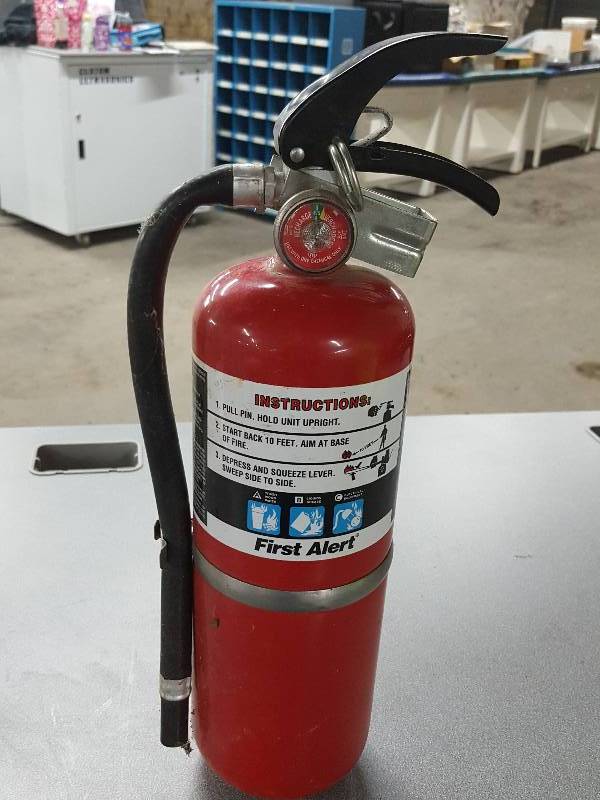 lot 2109 image: Full First Alert 20 tall rechargeable fire extinguisher