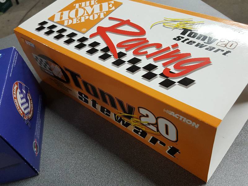 lot 2128 image: New in the box is this Tony Stewart #20 race car #1 of 5,508 made.