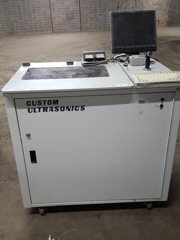 lot 2174 image: If you want to get your instrument(s) clean, this Custom Ultrasonics washing and sterilizing machine will get that job done.
