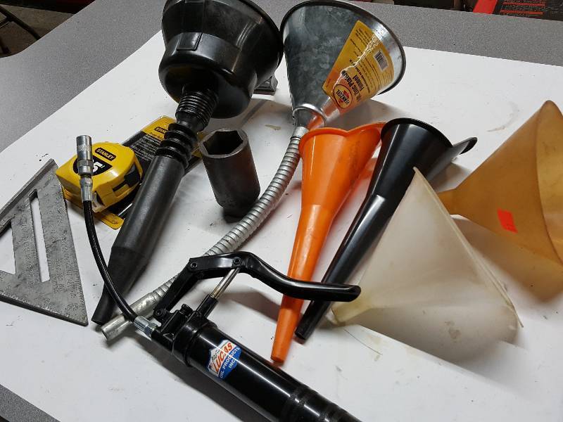 lot 8075 image: Another bargain package to gt to a $10-$15 bid.  6 funnels, 1 tri square, 25 foot NEW Stanley tape measure