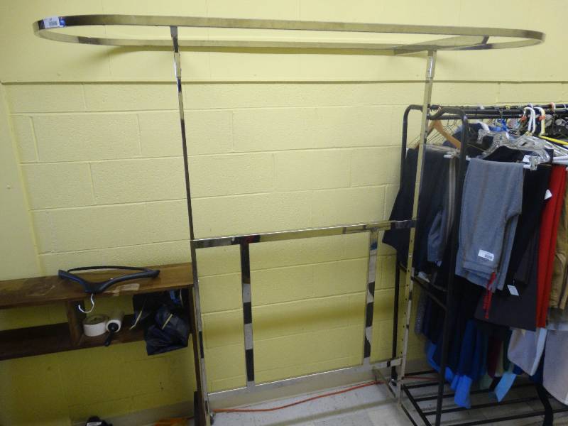 lot 352 image: Metal Clothes Rock On Wheels. No Content.
