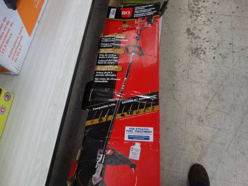 lot 144 image: Toro 2 Cycle Straight Shaft Gas Trimmer.