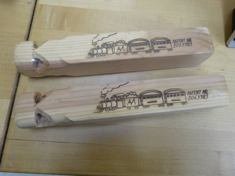 lot 879 image: 2 Wooden Train Whistle.