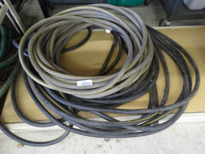 lot 1028 image: 2 Water Hoses.