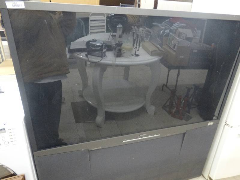 lot 1058 image: Large Mitsubishi HD Tv 1080P TV WRemote.