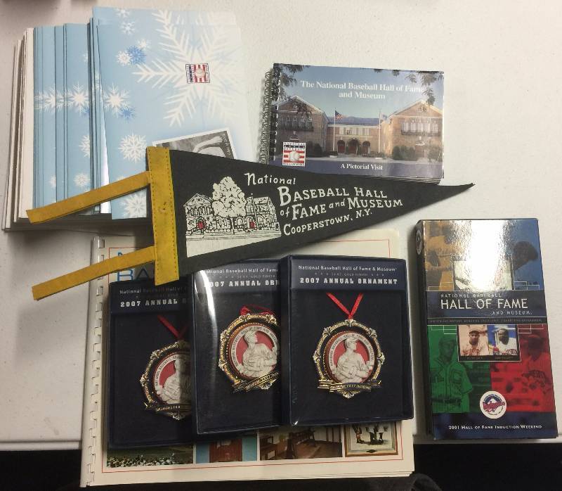 lot 1111 image: Huge Lot of National Baseball Hall of Fame Ephemera VHS Tape, Christmas Ornaments, Photo Books, Christmas Cards, etc