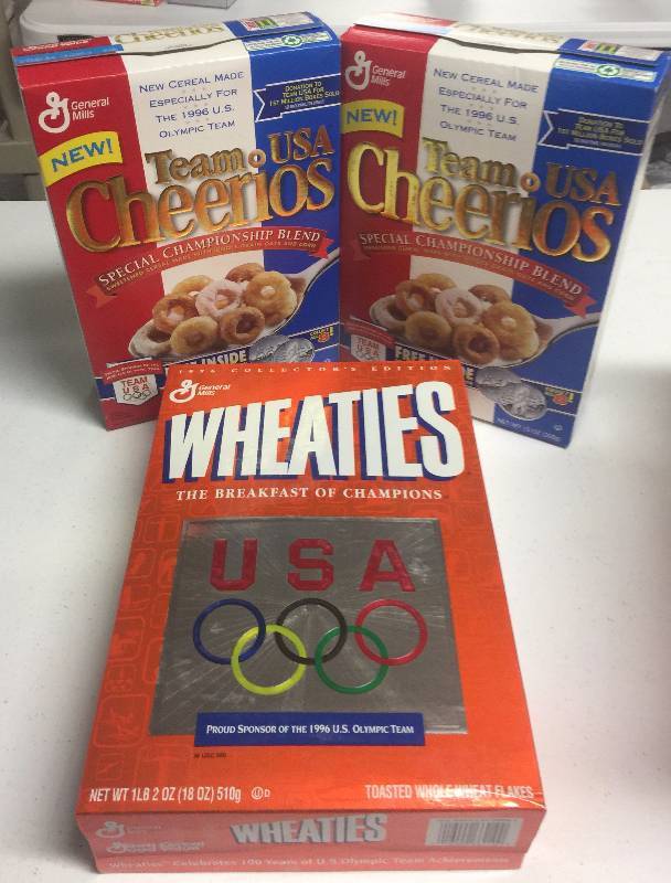 lot 1180 image: Three Unopened Olympics Wheaties Boxes Full of Cereal and 1996 Olympics Sponsors
