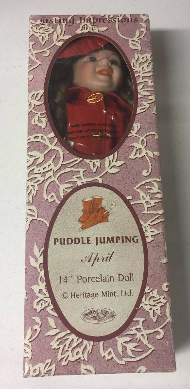 lot 1214 image: Heritage Mint Lasting Impressions Puddle Jumping April 14 Inch Porcelain Doll New In Box