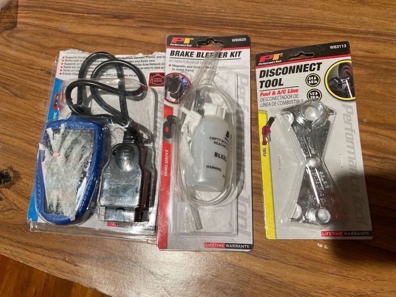 lot 1407 image: Performance Tool W2976 OBDII Multilingual Scan Tool, Disconnect Tool W83113, Brake Bleeder Kit W80625