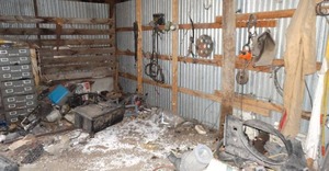 lot 11110 image: Variety of Auto Parts & Misc  Contents in SE Corner of Barn  2 Metal File Cabinets w Contents  Items on Wall and Floor  East 12 of West Barn