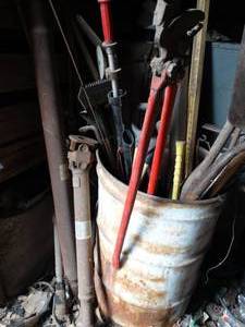 lot 11116 image: Barrel Full of Tools and More  Drive Shafts  on Left inside East 12 of West Barn