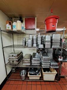 lot 20835 image: Contents of Shelf (Assortment of Drop Well Pans Salad Tosser Tub of Lids)