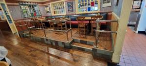 lot 49621 image: Chrome Railing Sections On Elevated Dining Area