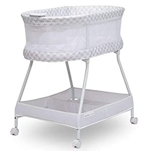 lot 27913 image: Delta Children Sweet Dreams Bassinet with Airflow Mesh Bedside Portable Crib with Vibration Lights and Music, Grey Infinity (B08VKXMD2M)