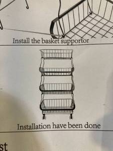 lot 35563 image: 4 TIER BASKET STORAGE WITH WHEELS