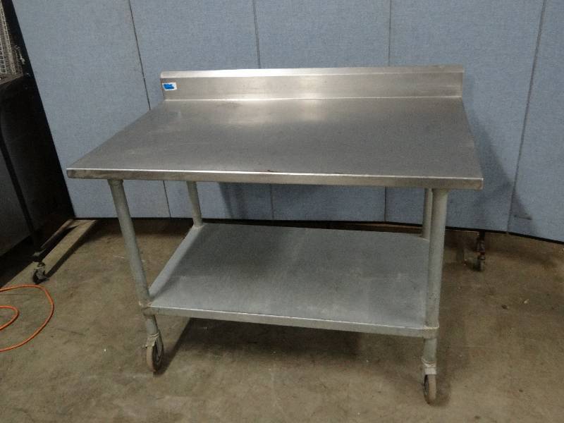 lot 2315 image: Stainless 48 Work top Table w Galvanized under Shelf on Casters