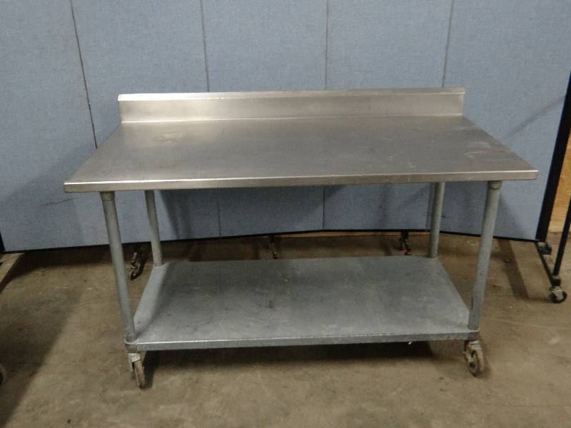 lot 2316 image: Stainless 60 Work top Table w Galvanized under Shelf on Casters