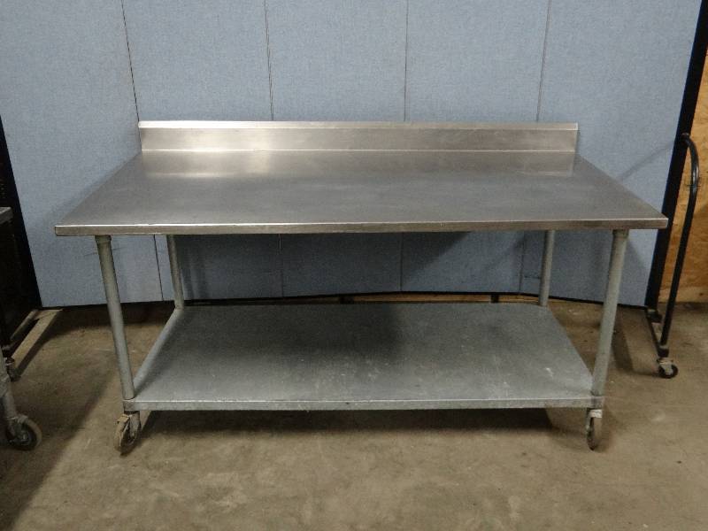 lot 2317 image: Stainless 72 Work top Table w Galvanized under Shelf on Casters