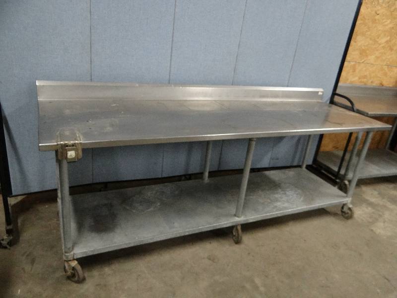 lot 2325 image: Stainless Top 96 Work Table w 5 Back Splash on Casters