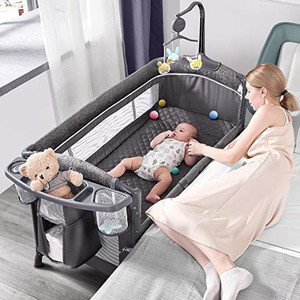 lot 5786 image: $$195 RETAIL--ADOVEL Baby Bassinet Bedside Crib, Pack and Play with Mattress, Diaper Changer and Playards from Newborn to Toddler