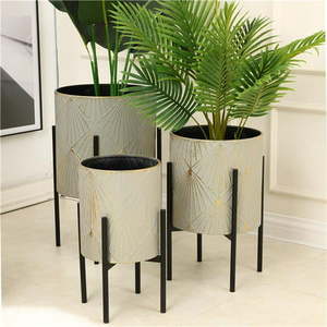 lot 2474 image: LuxenHome 3-Piece Gray and Gold Metal Cachepot Planters with Black Stand