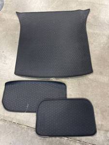 lot 41889 image: Oreal Cargo Mats for Unknown Vehicle - Large mat is 43�� long and about 36�� Wide. Smaller mats are 23��x14�� and 28��x14��. They are thick black rubber.