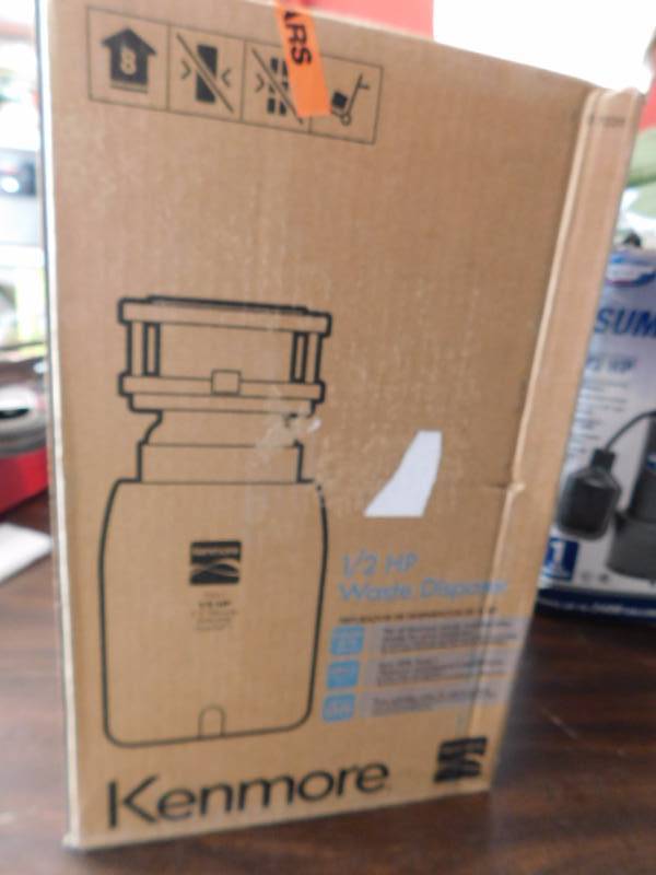 lot 1144 image: Kenmore 12 horse garbage disposal