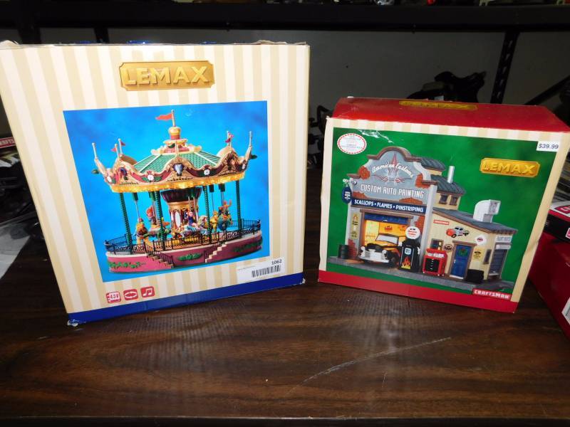 lot 1062 image: Christmas village merry go round and auto shop