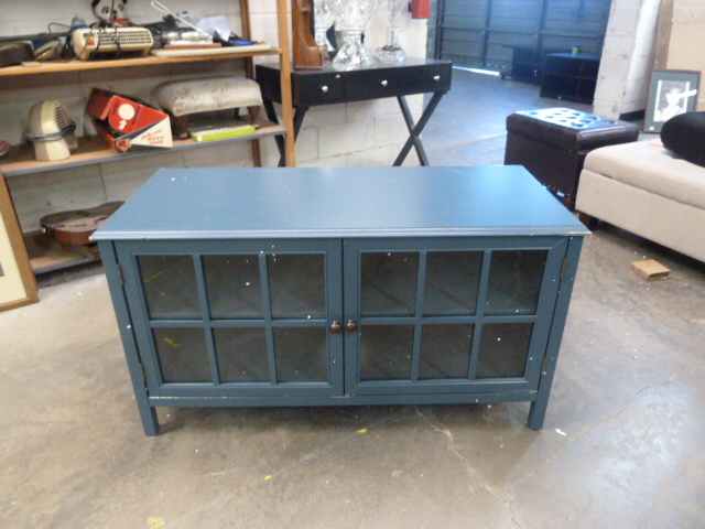 lot 8 image: TEAL TV STAND with glass doors