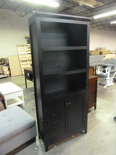 lot 42 image: BLACK BOOKCASE WITH DOORS...see pictures for conditions