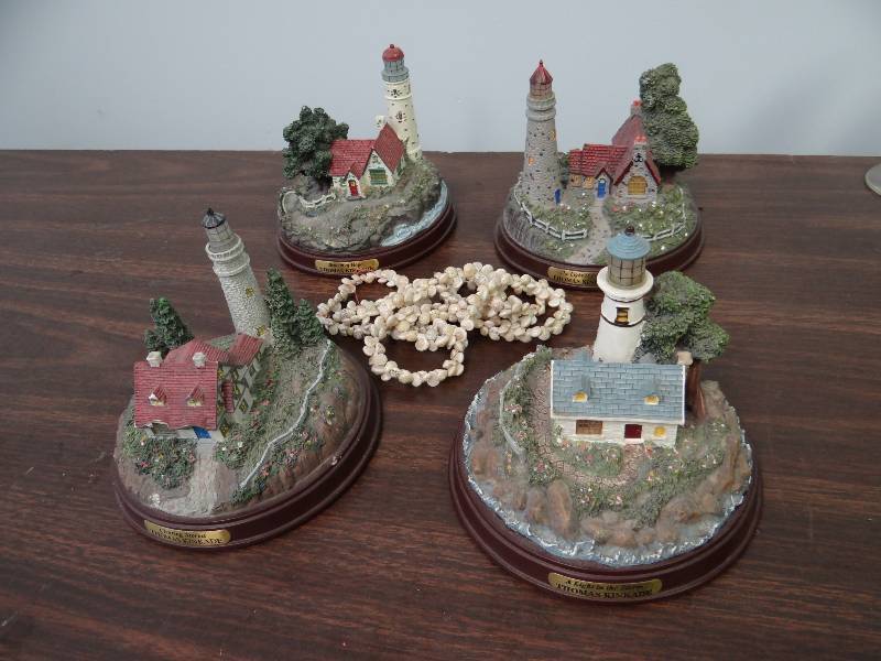 lot 2947 image: (4) Lighted Thomas Kinkade Battery Operated Decorative Light House