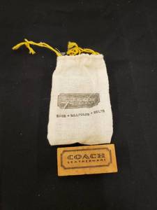 lot 5774 image: Coach eraser in bag