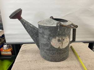lot 9106 image: galvanized water can